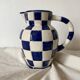 Antique blue and white checkered pitcher