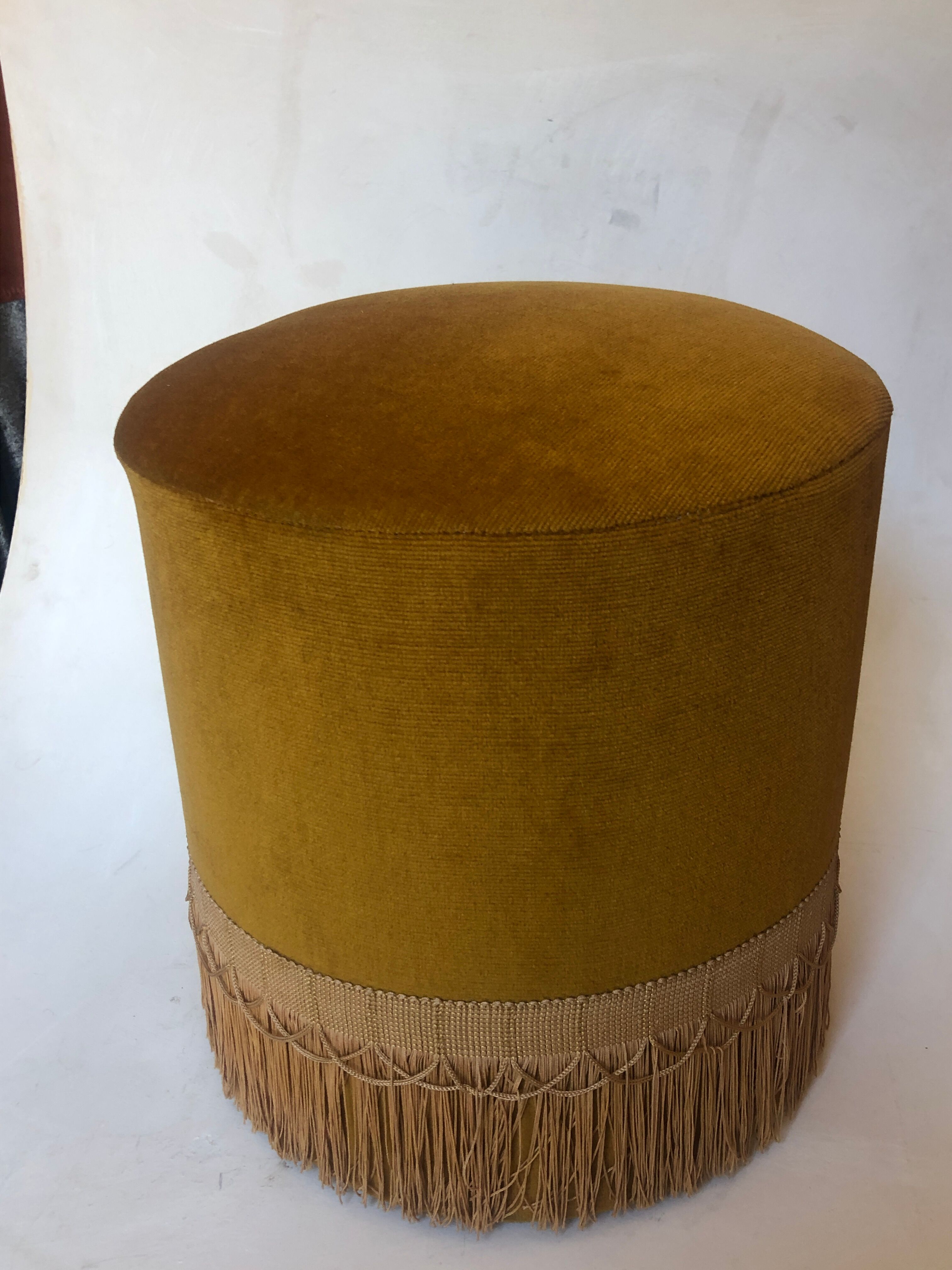 Velvet and fringed ottoman