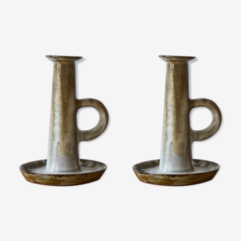 Duo of sandstone candlesticks