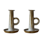 Duo of sandstone candlesticks