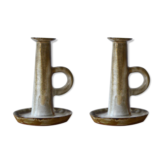Duo of sandstone candlesticks
