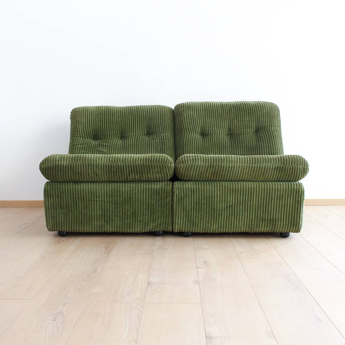 Modular vintage sofa with green cord upholstery
