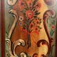 Alsatian bonnet maker in painted softwood with floral decorations