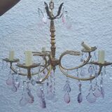 Antique chandelier with its papillae, reflection changing according to exposure