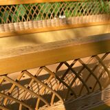 Vintage wooden and rattan baby cot from the 1960s.