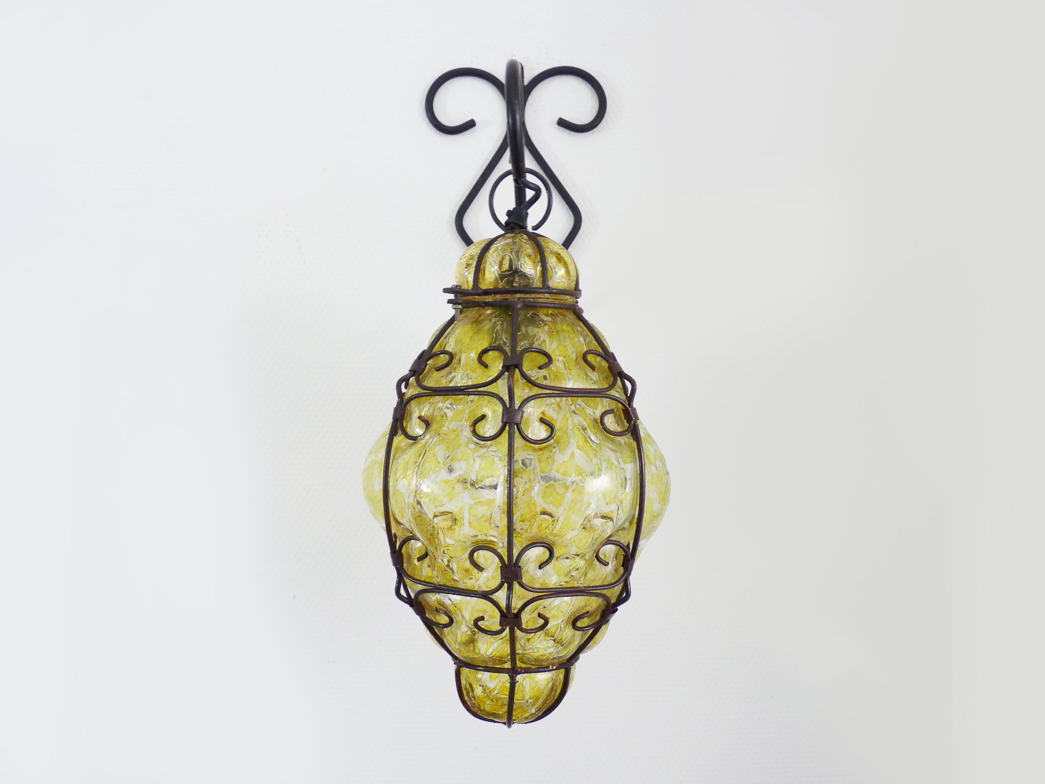 Italian vintage wall lamp in yellow blown glass and wrought iron. Year 70 80