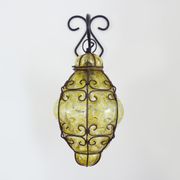 Italian vintage wall lamp in yellow blown glass and wrought iron. Year 70 80