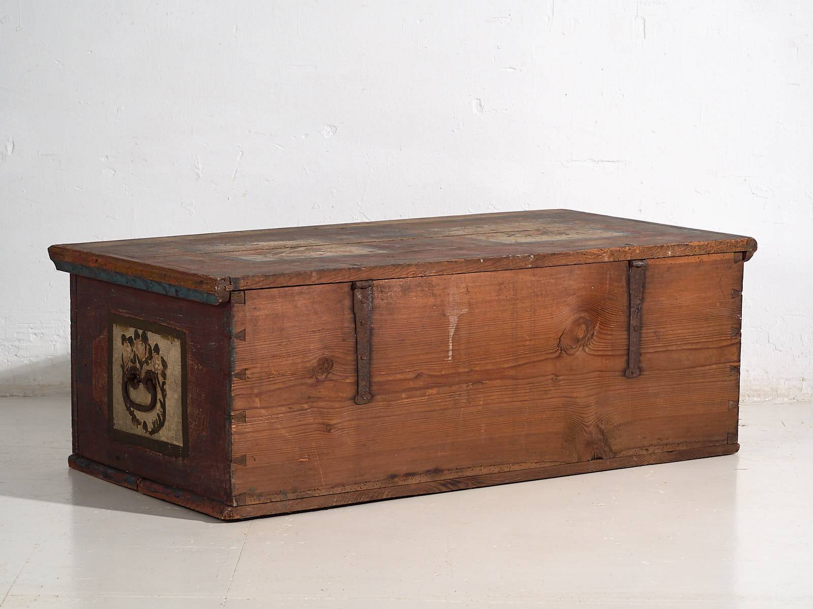Antique red trunk with floral decoration (c.1920)
