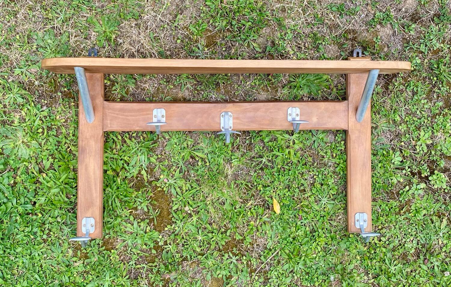 Wall-mounted coat rack with vintage hooks