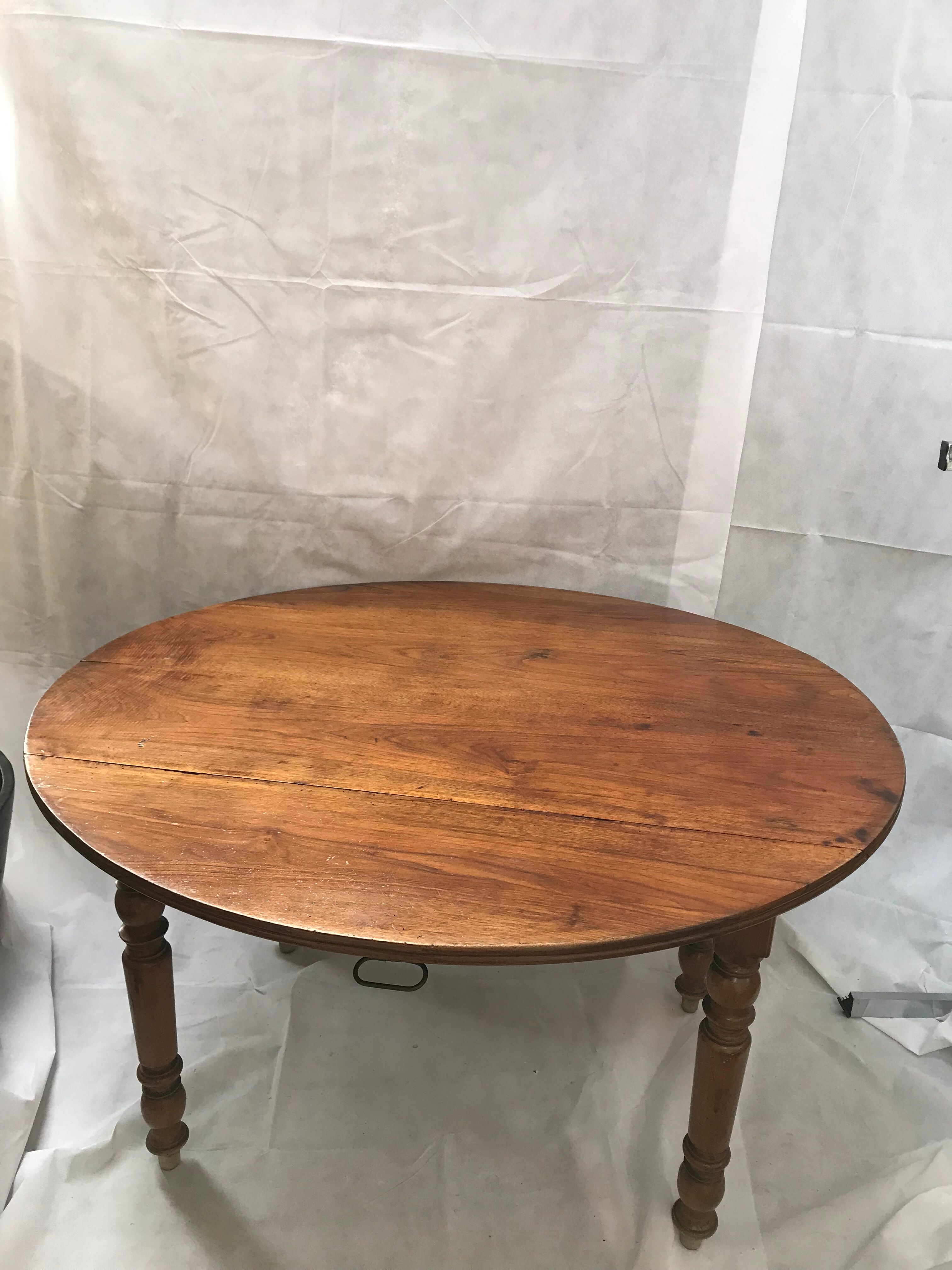 Oval wooden table with shutter