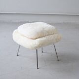 Womb Chair and Ottoman in fluffy white fabric by Eero Saarinen