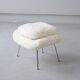 Womb Chair and Ottoman in fluffy white fabric by Eero Saarinen