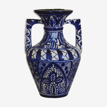 White hand-painted ceramic vase with blue patterns