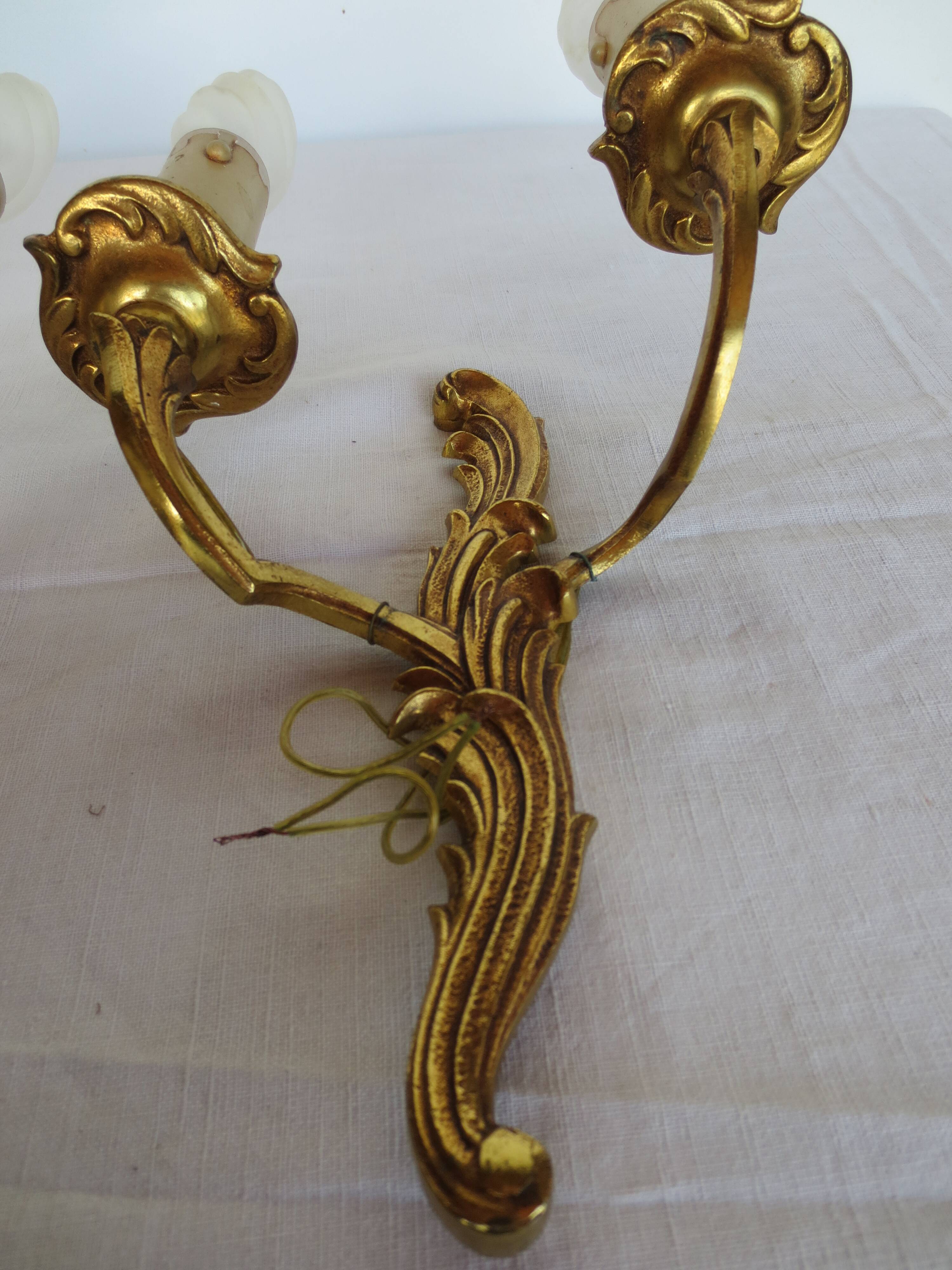 Pair of double wall lights in gilded bronze