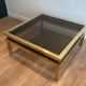 Coffee table in brass and black lacquer by Guy Lefèvre for Maison Jansen