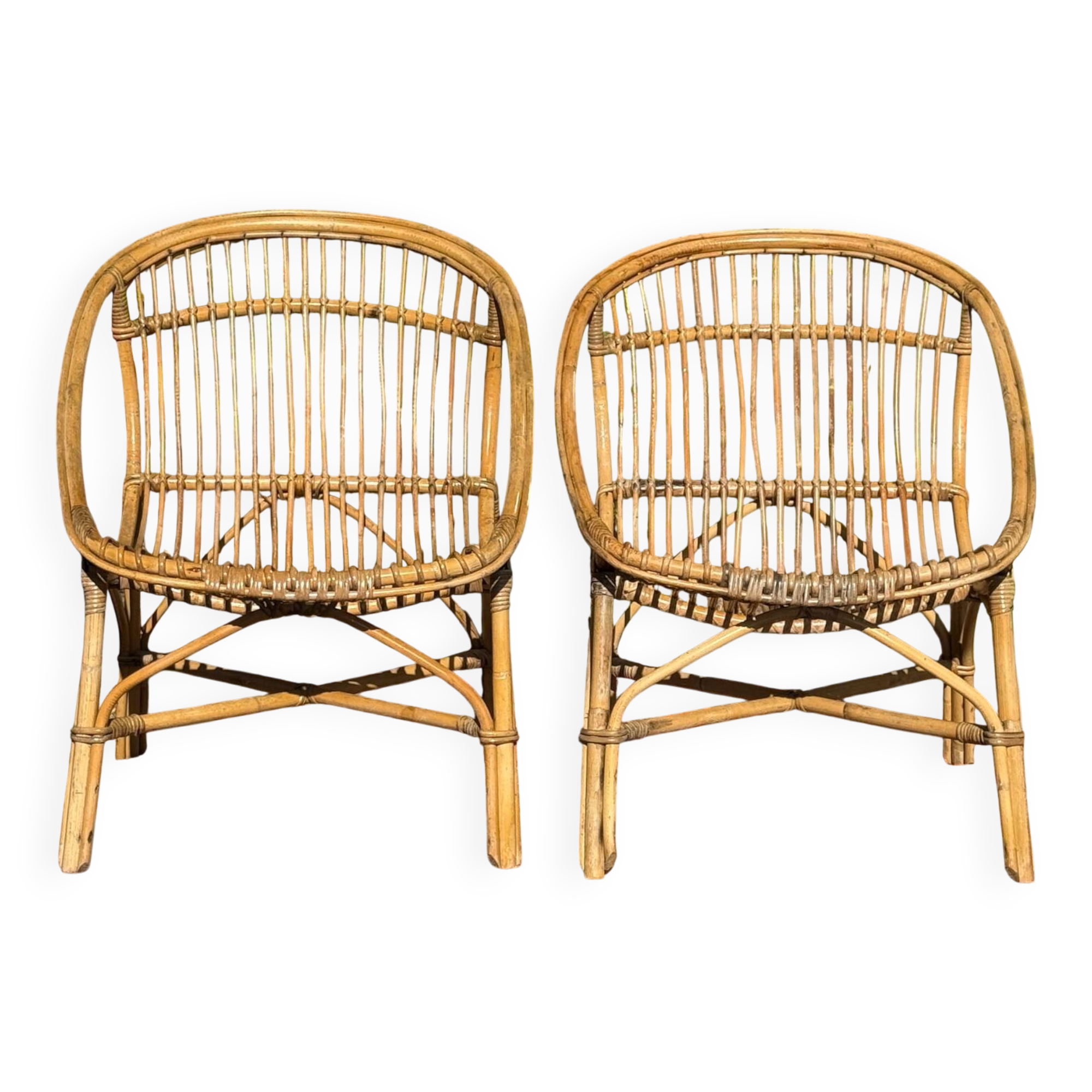 Pair of 1950s rattan armchairs from France.