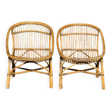 Pair of 1950s rattan armchairs from France.