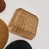 Wall composition of wicker baskets and trays.