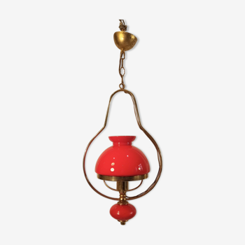 Baroque pendant light with golden brass corolla and red glass ball