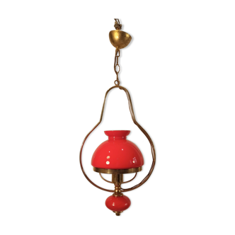 Baroque pendant light with golden brass corolla and red glass ball