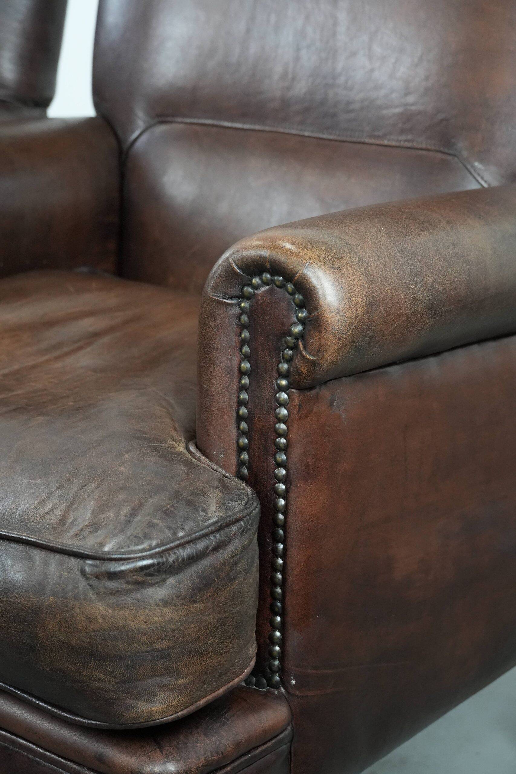 Set of two characterful sheepskin armchairs with a beautiful deep colour