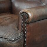 Set of two characterful sheepskin armchairs with a beautiful deep colour