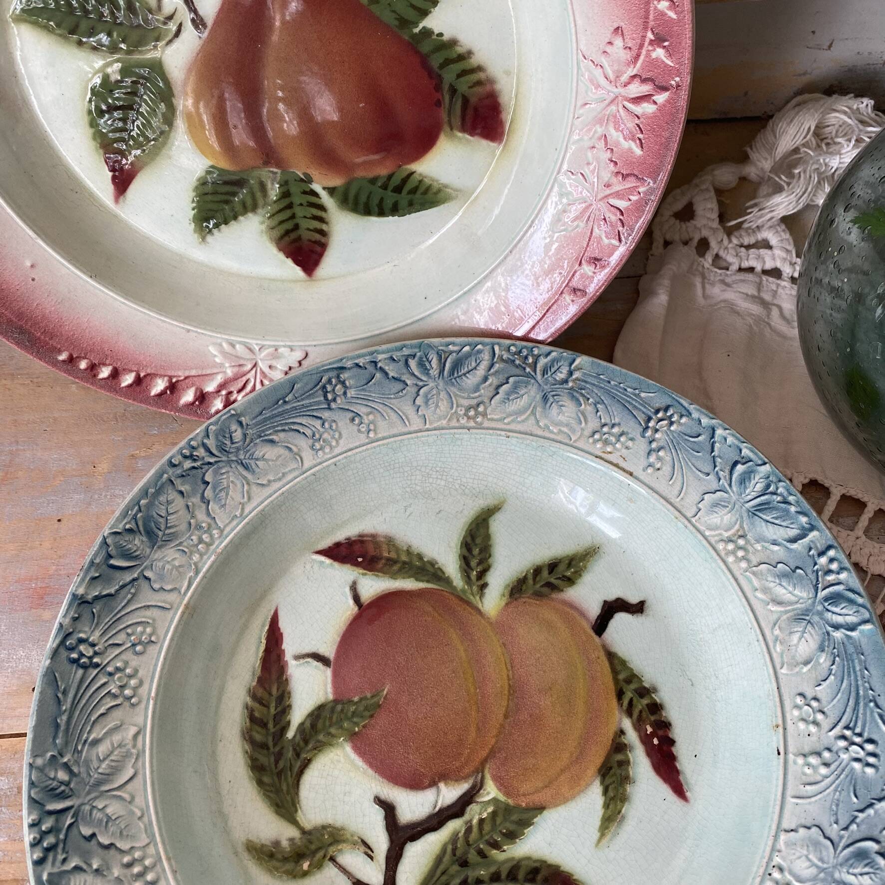Shallow dish in slip with fruit decoration of peaches.