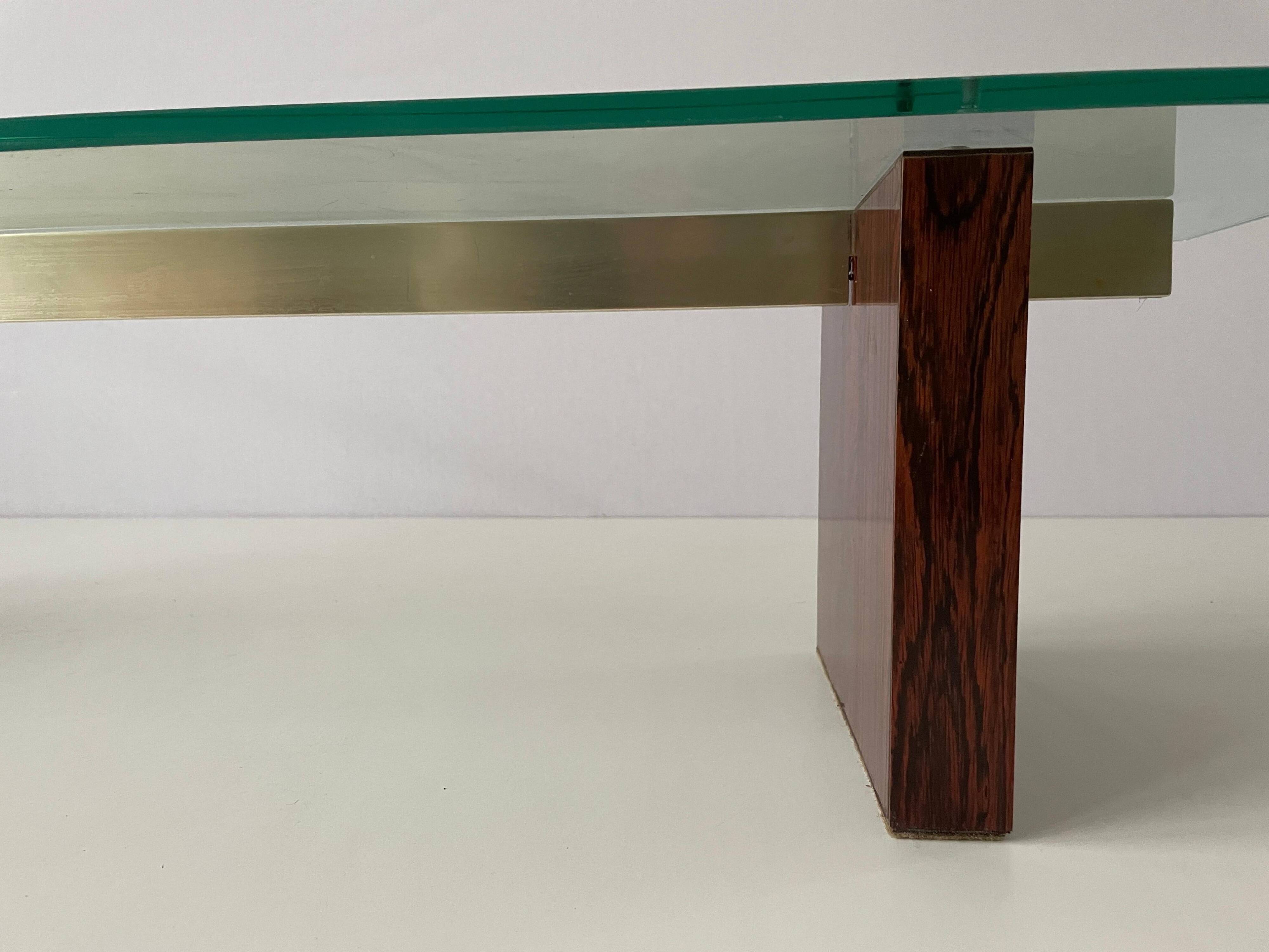 Mid-century minimalist thick glass coffee table, rosewood legs, 1960, Germany.