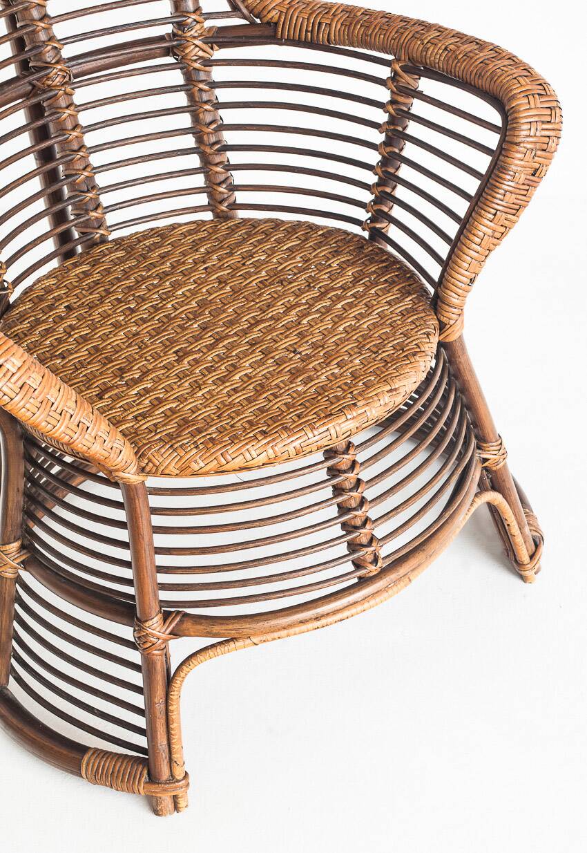 Vintage high armchair in cane/rattan. France, 1960s