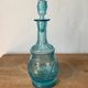 Old turquoise blue molded glass carafe