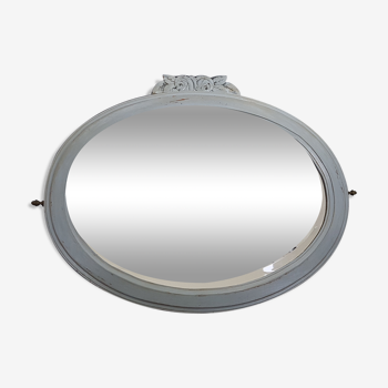 Ancien miroir ovale, verre biseauté et bois patiné gris vers 1930- 74x59 cm
