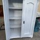 Vintage two-door wardrobe in painted white wood — late 19th century Hungarian style.