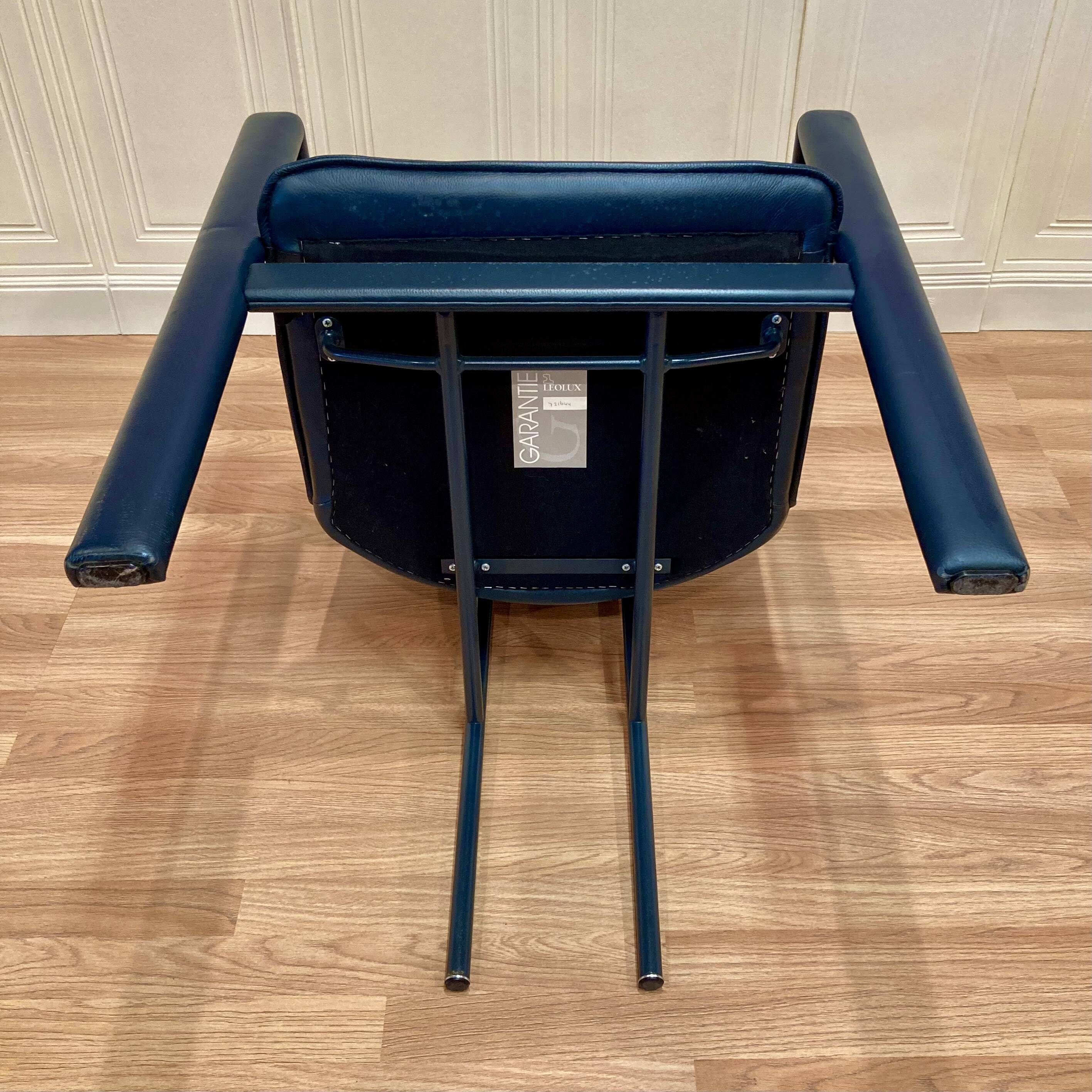 Set of 3 designer leather and metal armchairs.