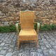 Fauteuil en rotin avec accoudoirs