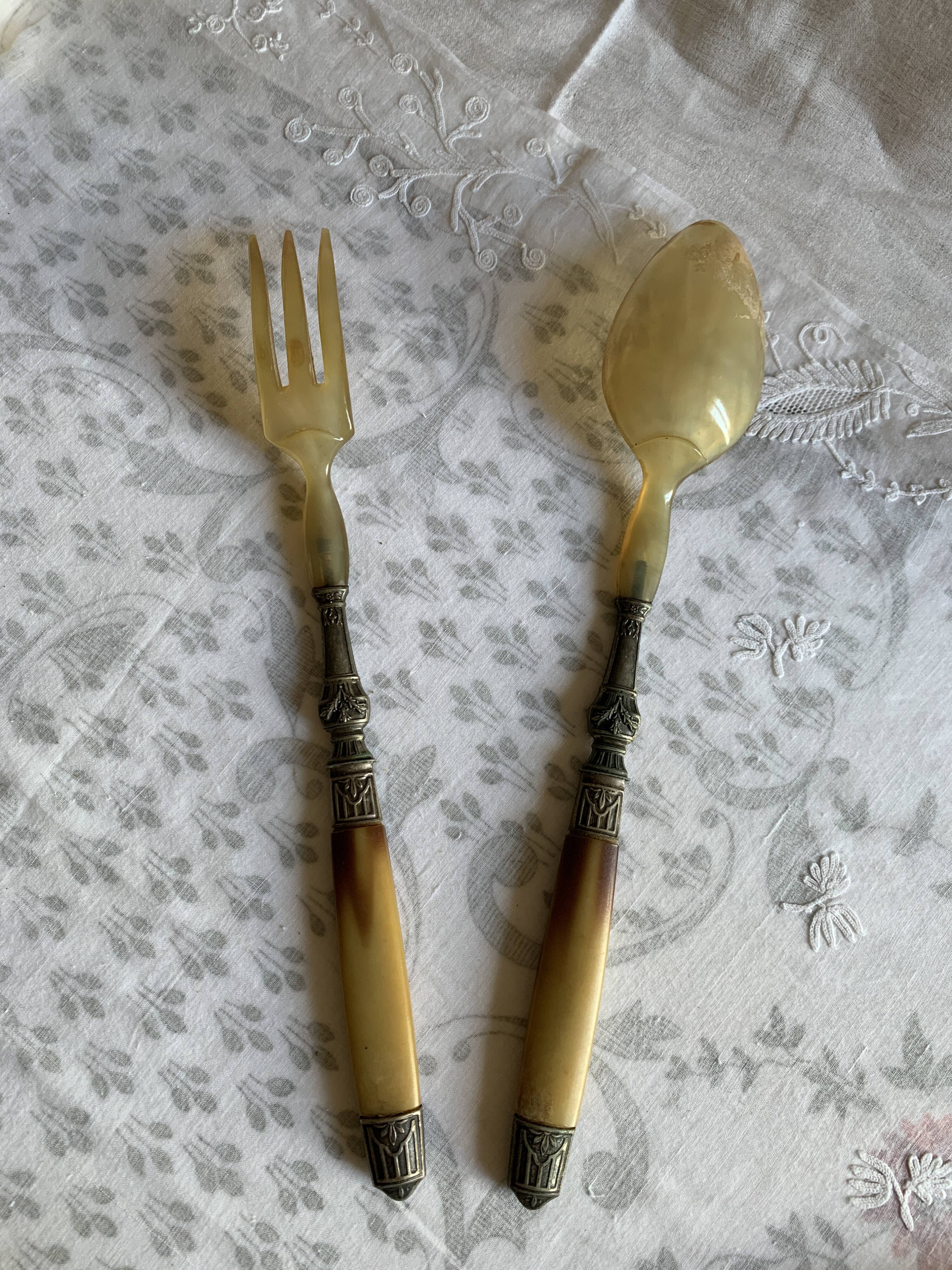 Horn and metal salad servers from the 1920s