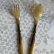 Horn and metal salad servers from the 1920s