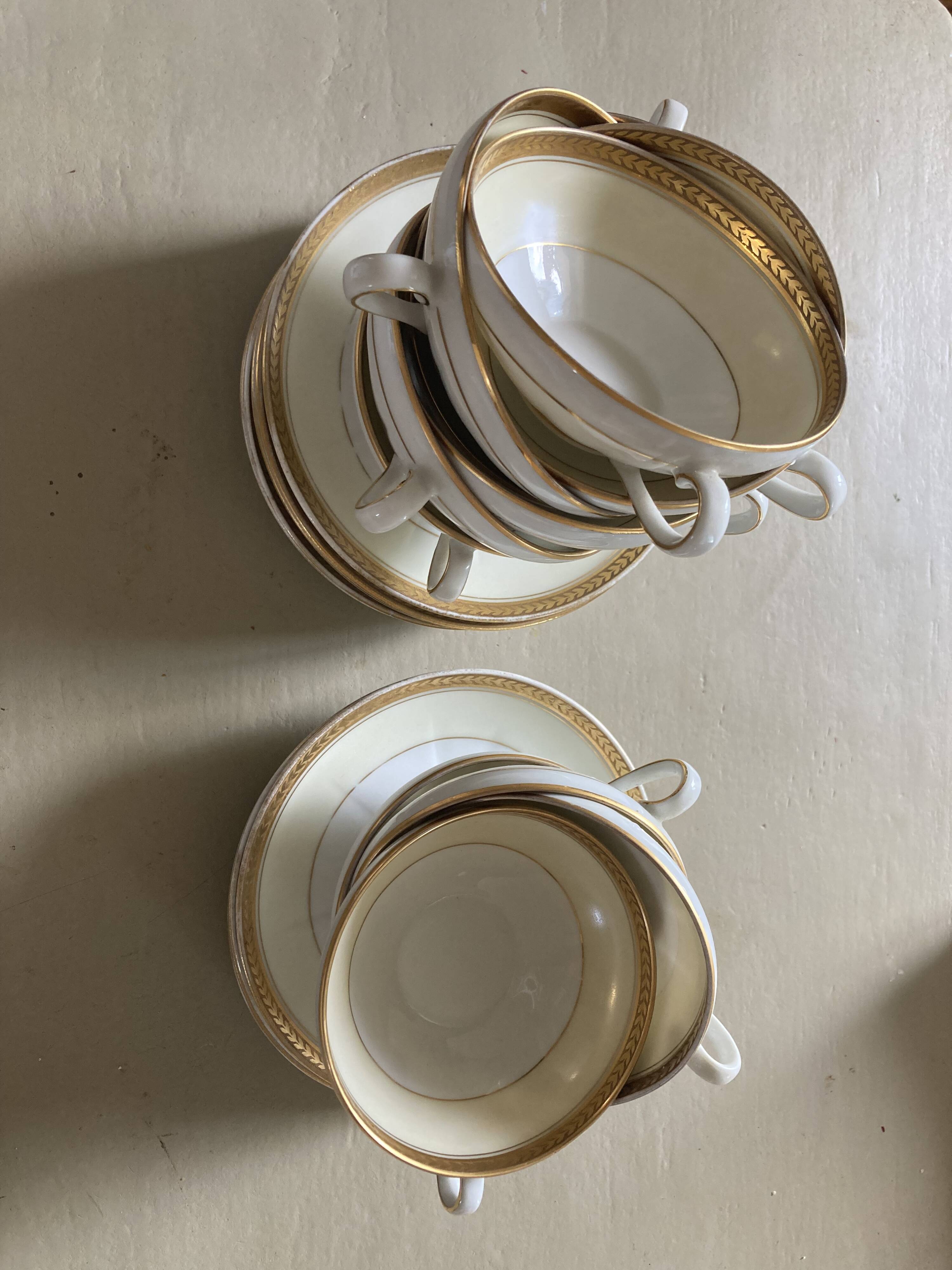 Vintage Limoges porcelain chocolate teacups in pastel yellow and gold