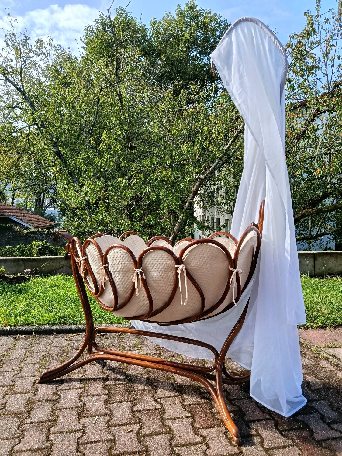 Antique cradle by J&J Khon