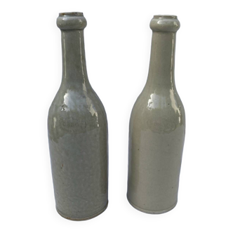 Pair of old Bossot stoneware bottles