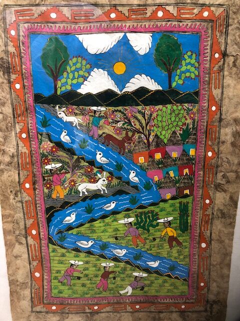 Table framed by a naïve Mexican illustration