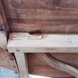 Oval table of grape harvesters from the Southwest in cherry wood