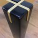 Italian coffee table from the 70s, smoked glass, black and gold lacquered wood.