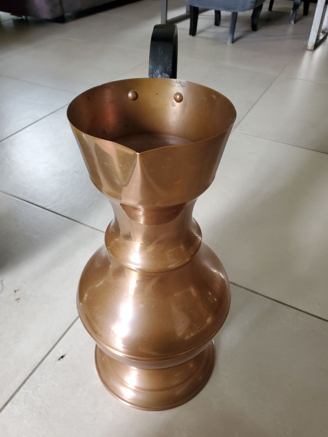 Copper jug with iron handle