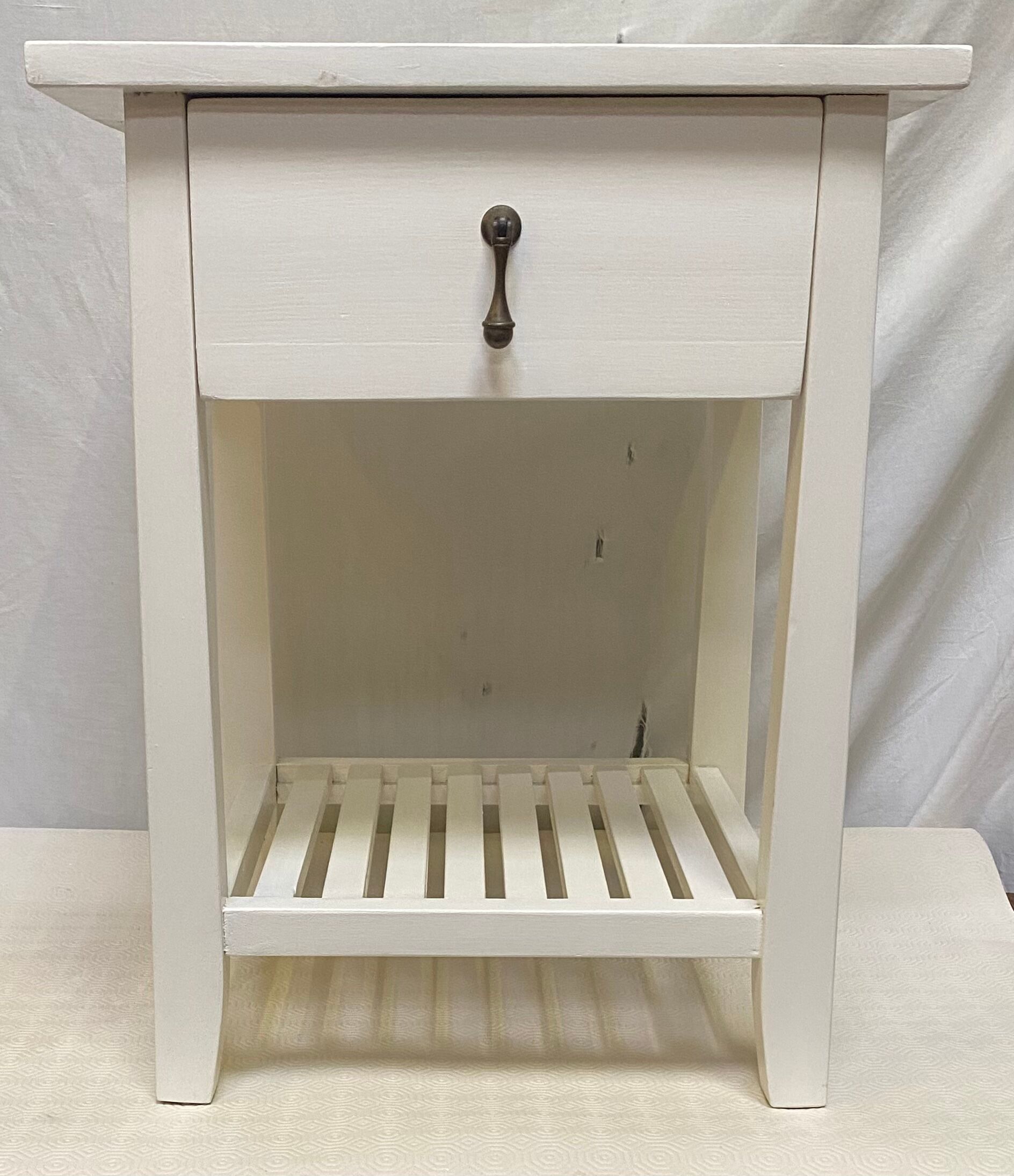 Wooden bedside table painted white