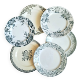 Old mismatched flat plates made of ironstone earthenware.