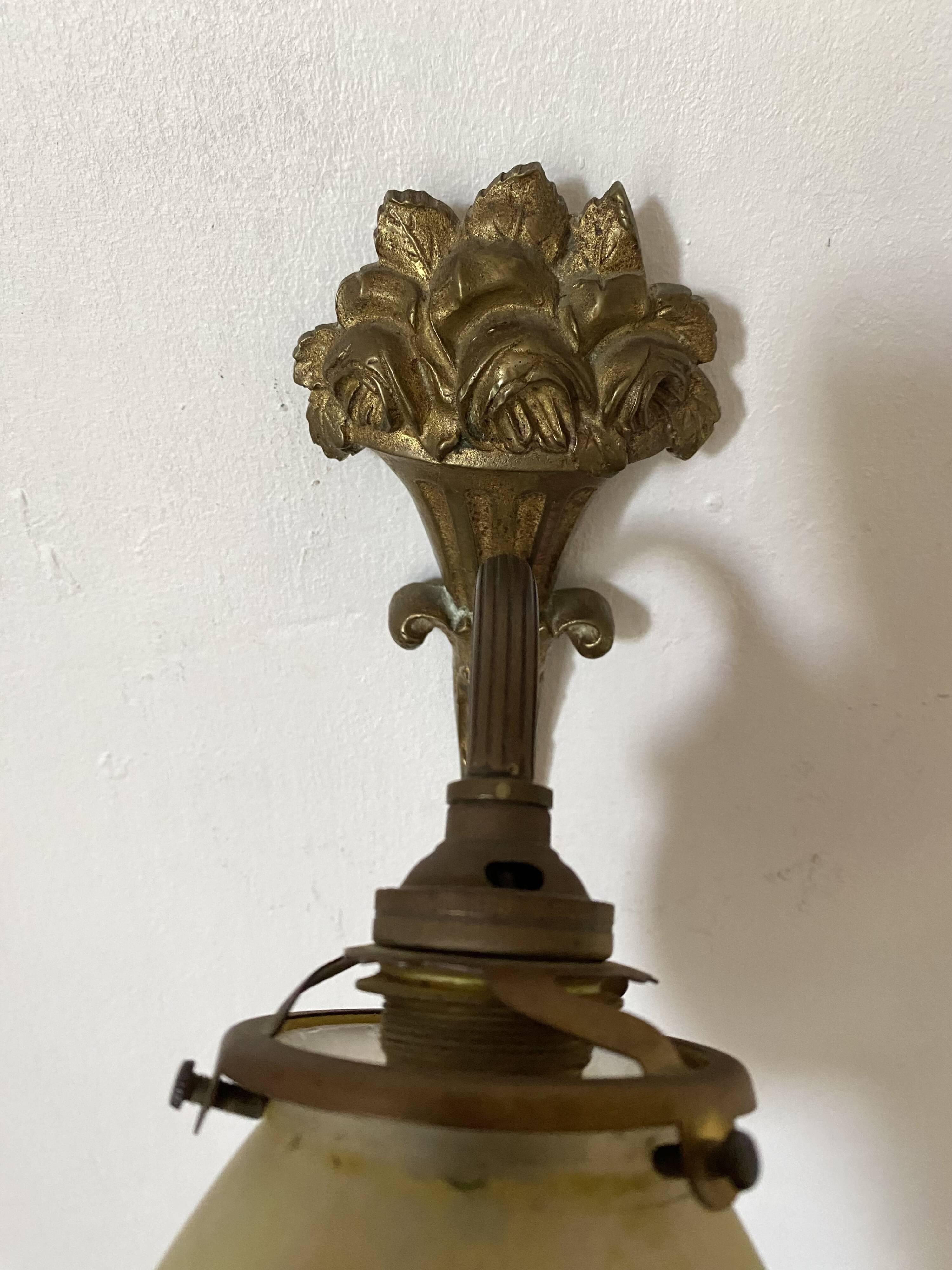 Antique bronze and glass paste wall light