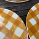 Set of nine flat ceramic plates yellow Scottish decoration in yellow/orange gridded ceramic
