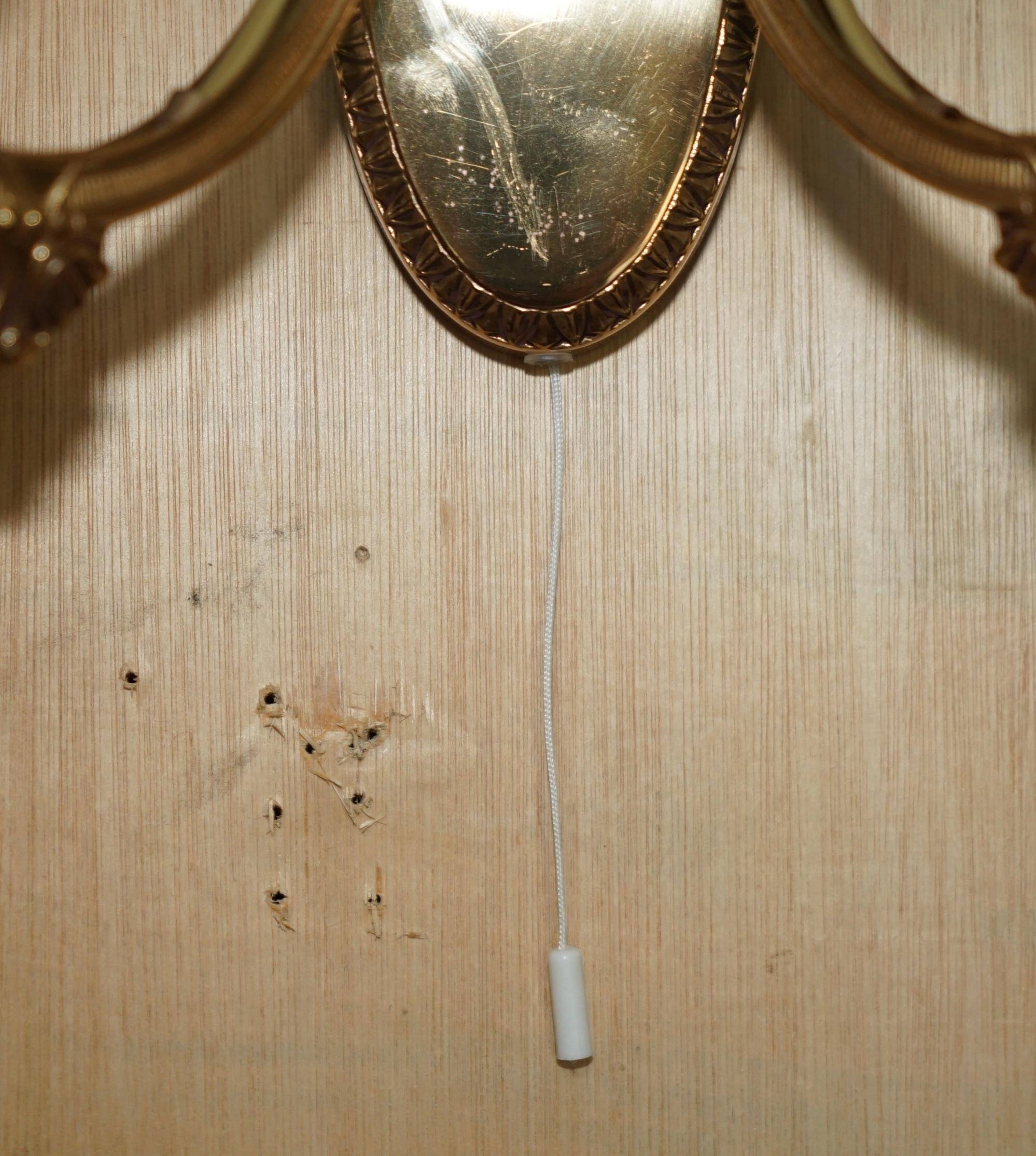 Reccagni wall light pair in brass and frosted glass.