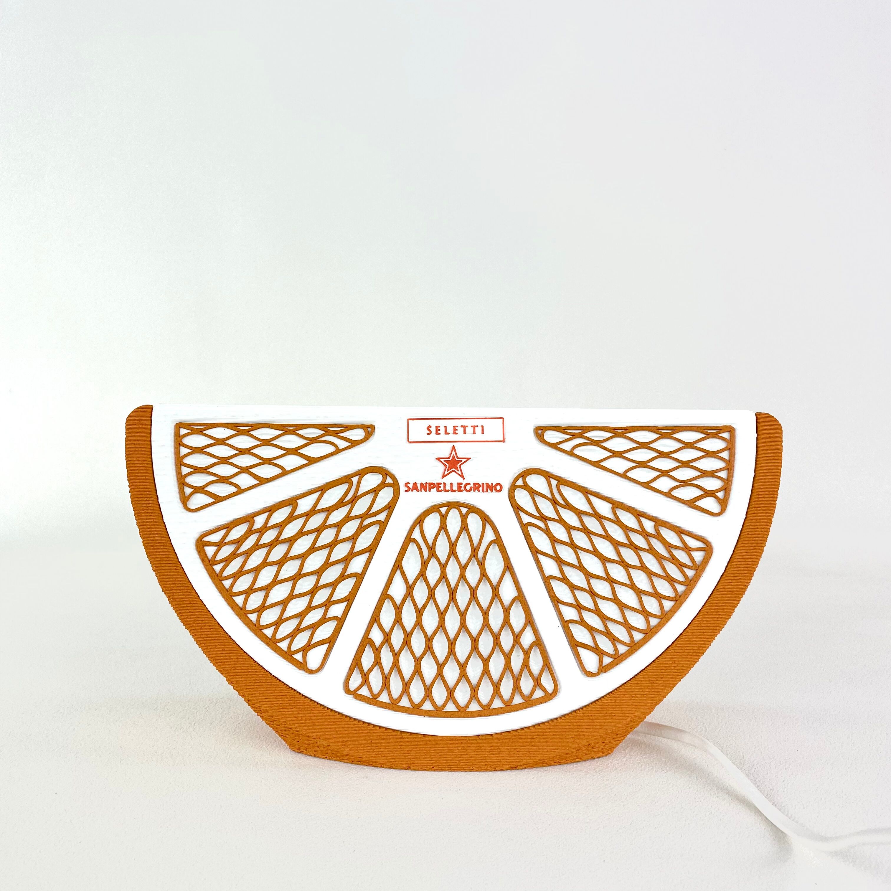 Orange quarter table lamp Seletti and Sanpellegrino