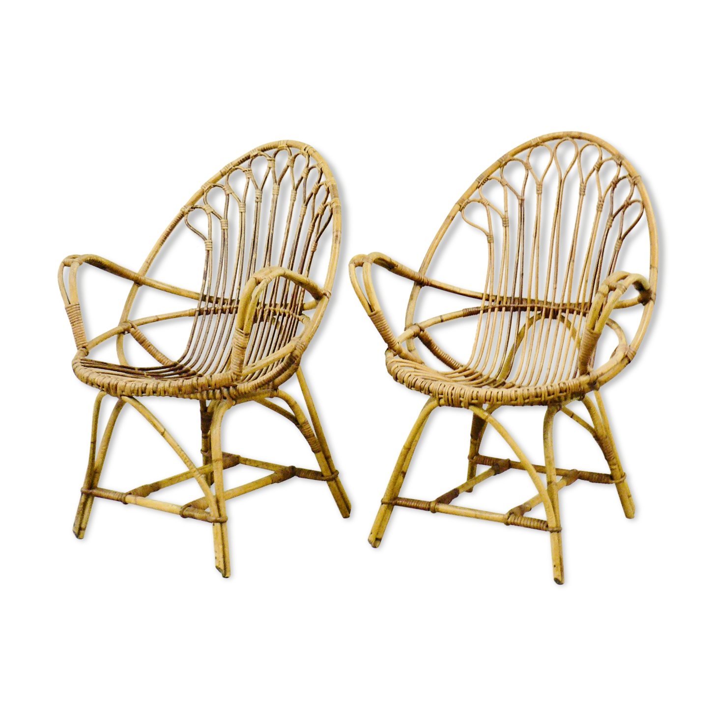 A pair of rattan chairs